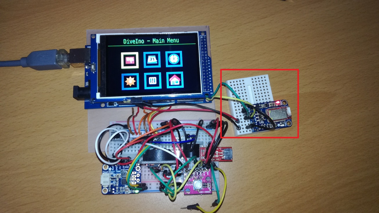 Adafruit Bluefruit LE UART Friend module is attached to DiveIno